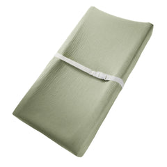 Comfy Cubs muslin fitted pad cover on a flat changing pad, soft and breathable.