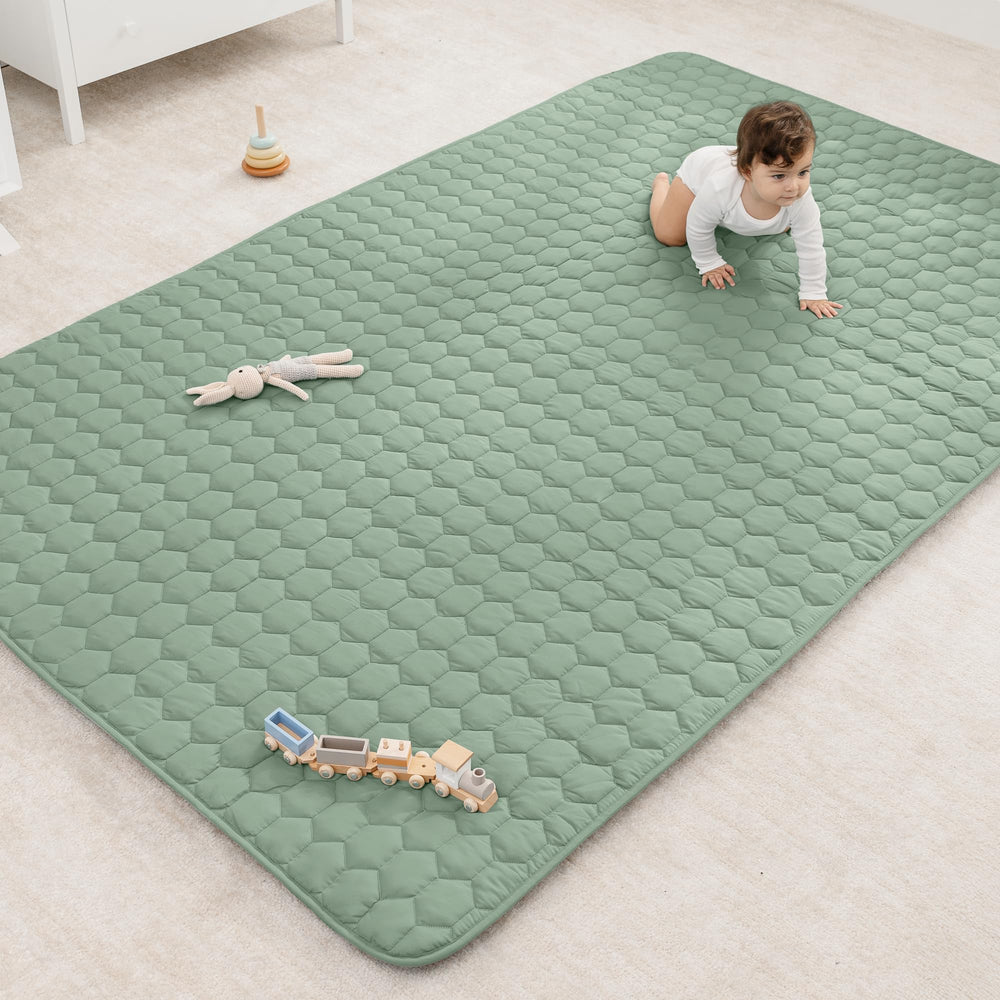 Comfy Cubs rectangle play mat in fern on floor, soft surface for babies
