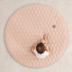 Comfy Cubs round mat with quilted top adds extra cushioning during play.