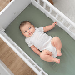 Comfy Cubs wooden bedside bassinet with side rail open for easy nighttime access