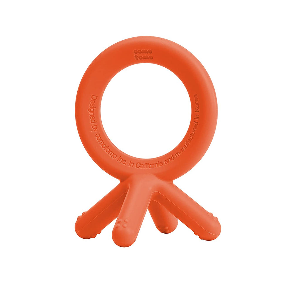 Comotomo orange teether mimics baby fingers for natural chewing.