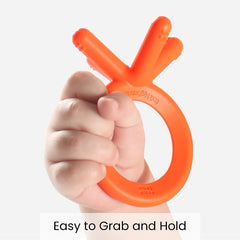 Comotomo orange teether with intuitive grip for easy grabbing.