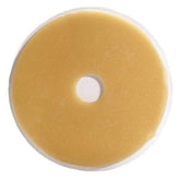 ConvaTec Eakin Cohesive Slim Ostomy Seal, 2-inch diameter, molded to uneven skin surfaces to reduce gaps.