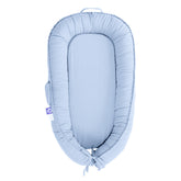 CooCooBaby infant lounger cover in baby blue, offering a cozy, hug-like feel.