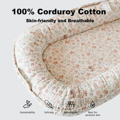 CooCooBaby lounger fabric closeup shows 100% cotton texture and soft skin-friendly feel.