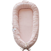 CoocooBaby infant lounger in mistyrose corduroy cover offers breathable lounging comfort.