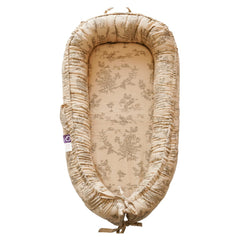 CooCooBaby Poem Muslin infant lounger cover offers breathable comfort for newborn lounging.
