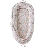 CooCooBaby Wonderland infant lounger close-up showing soft cotton cover and breathable design.