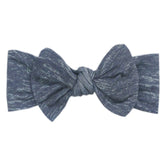 Copper Pearl premium denim headband bow for newborns, stylish and soft.