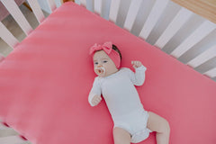 Copper Pearl newborn fit bow stays secure as baby grows.