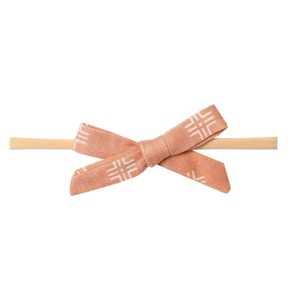Copper Pearl baby bows soft headband for newborns, ultra-soft and gentle on delicate hair.