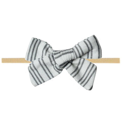Copper Pearl Classic Baby Bow Midtown worn on a newborn for gentle comfort.