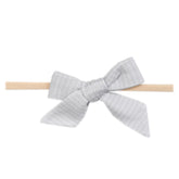 Copper Pearl Taylor bow closeup showing soft fabric and delicate bow detail