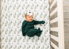 Copper Pearl fern premium knit crib sheet on mattress with full-elastic edge