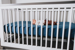 River color packaging that makes Copper Pearl crib sheets gift-ready.
