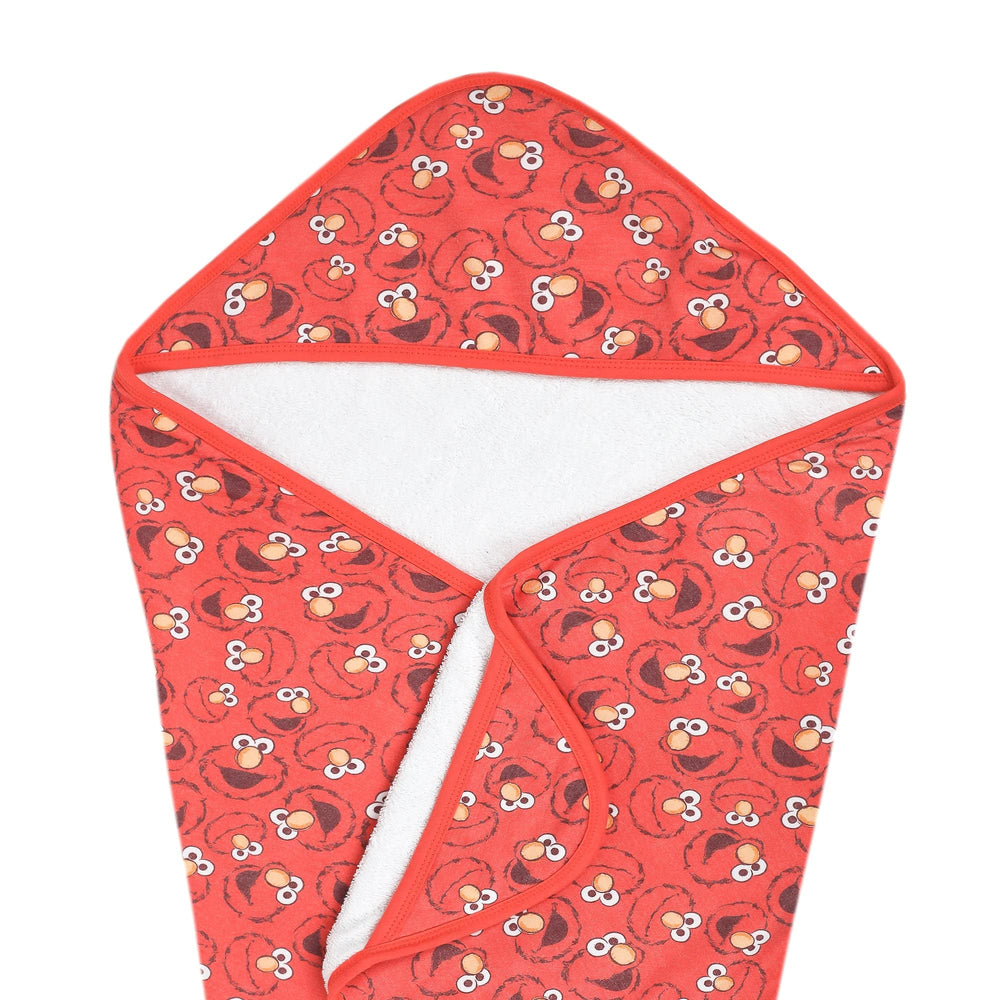 Copper Pearl hooded bath towel with Elmo hood keeps baby warm after bath