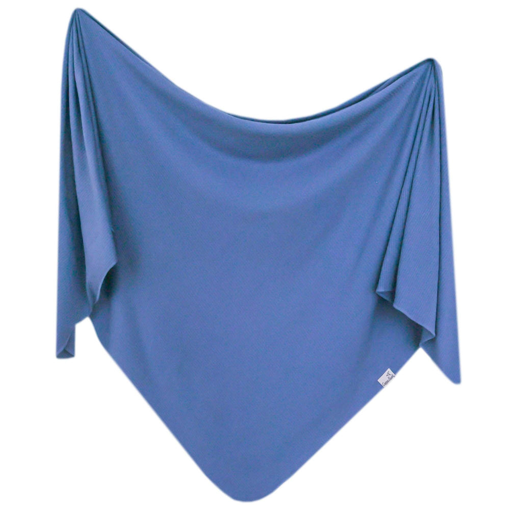 Copper Pearl Indigo swaddle blanket full-shot shows soft stretch for newborns