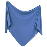 Copper Pearl Indigo swaddle blanket full-shot shows soft stretch for newborns