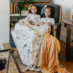 Copper Pearl Jumbo Knit 3-Layer Throw on couch shows spacious 60 x 72 inches.