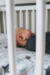 Copper Pearl Kai crib sheet on standard mattress ensuring baby comfort and safety.