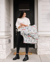 Copper Pearl Kringle shopping cart cover in use protects baby during shopping