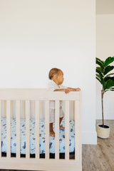 Fitted Leo crib sheet with full-edge elastic for snug standard mattress fit.