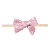 Copper Pearl Lucy Classic baby bow front view, soft fabric for newborn comfort