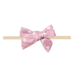 Copper Pearl Lucy Classic baby bow front view, soft fabric for newborn comfort