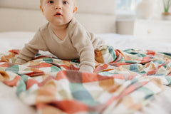 Copper Pearl Nicholas blanket used as stroller cover for shade and comfort
