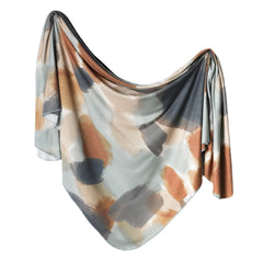 Copper Pearl Picasso large swaddle blanket in muted tones for gentle newborn wrapping