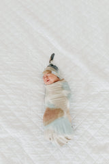 Copper Pearl Picasso large swaddle blanket folded neatly for gifting