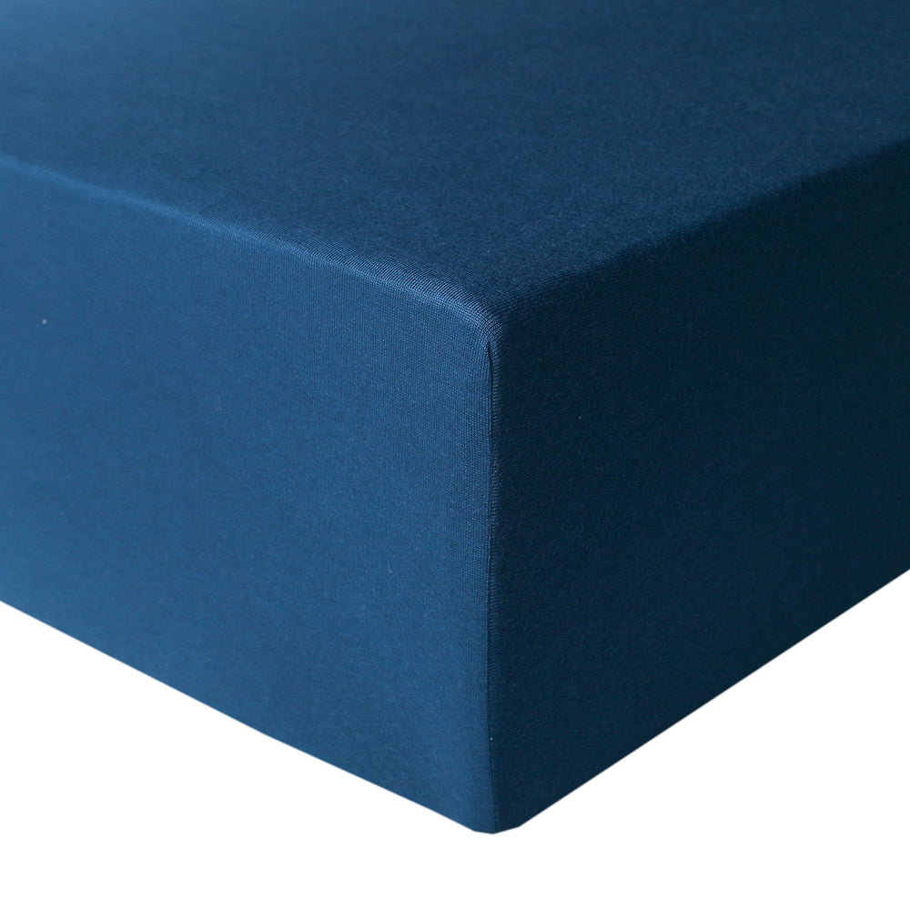 Copper Pearl River premium knit crib sheet on standard mattress, soft and breathable.