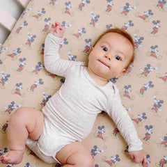 Copper Pearl premium knit crib sheet highlighting breathable fabric and easy care