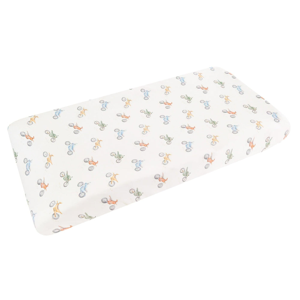 Copper Pearl Ryder knit cover folded in a cozy nursery setup for softness and style.