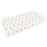 Copper Pearl Ryder knit cover folded in a cozy nursery setup for softness and style.