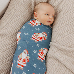 Copper Pearl Santa Claus swaddle in use, wrapping baby snugly for comfort