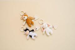 Copper Pearl On-The-Go Plush attaches to stroller or bag for portable entertainment.