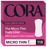 Cora topsheet organic cotton liner on soft surface, highlighting natural texture and skin-friendly feel.