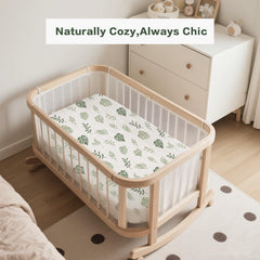 Coreeky leaf green muslin sheets on a bassinet showing soft fabric