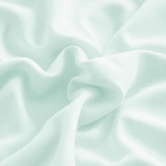 Cotton Stich mini pillowcase apple green close-up fabric showcases breathable 600-thread-count cotton.