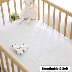 Cottonsis muslin crib sheet on mattress with deep 9-inch corners for a secure fit.