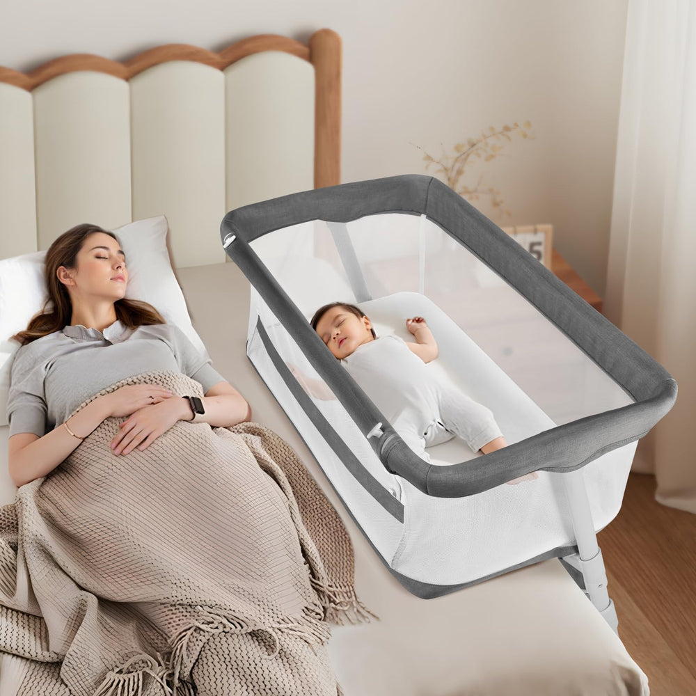 Cowiewie bassinet beside bed with secure attachment for nighttime care.