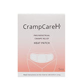 CrampCareH heat patch with wide wings applied to the lower abdomen for extended coverage.