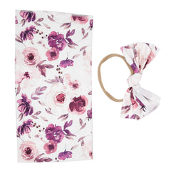 Crisis receiving blanket with deep purple flower design offers cozy warmth for newborns.