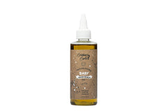 Cristina's Curls Nourishing Baby Hair & Scalp Oil bottle closeup for gentle hydration and sheen