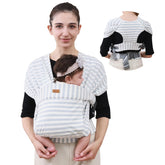 CUBY newborn wrap in green stripe front carry for hands-free bonding.