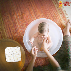 Cudlie Winnie the Pooh hooded towel in a cute nursery setup