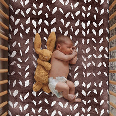 Culclendy soft fitted crib sheet in brown geometric pattern on a crib for snug, breathable comfort.