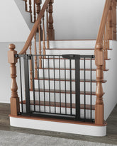 Cumbor baby gate on stairs with secure black finish for stair safety.