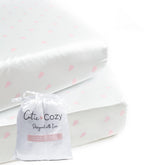 CutieCozy satin fitted crib sheet in white with pink hearts fits standard cribs securely and protects curls
